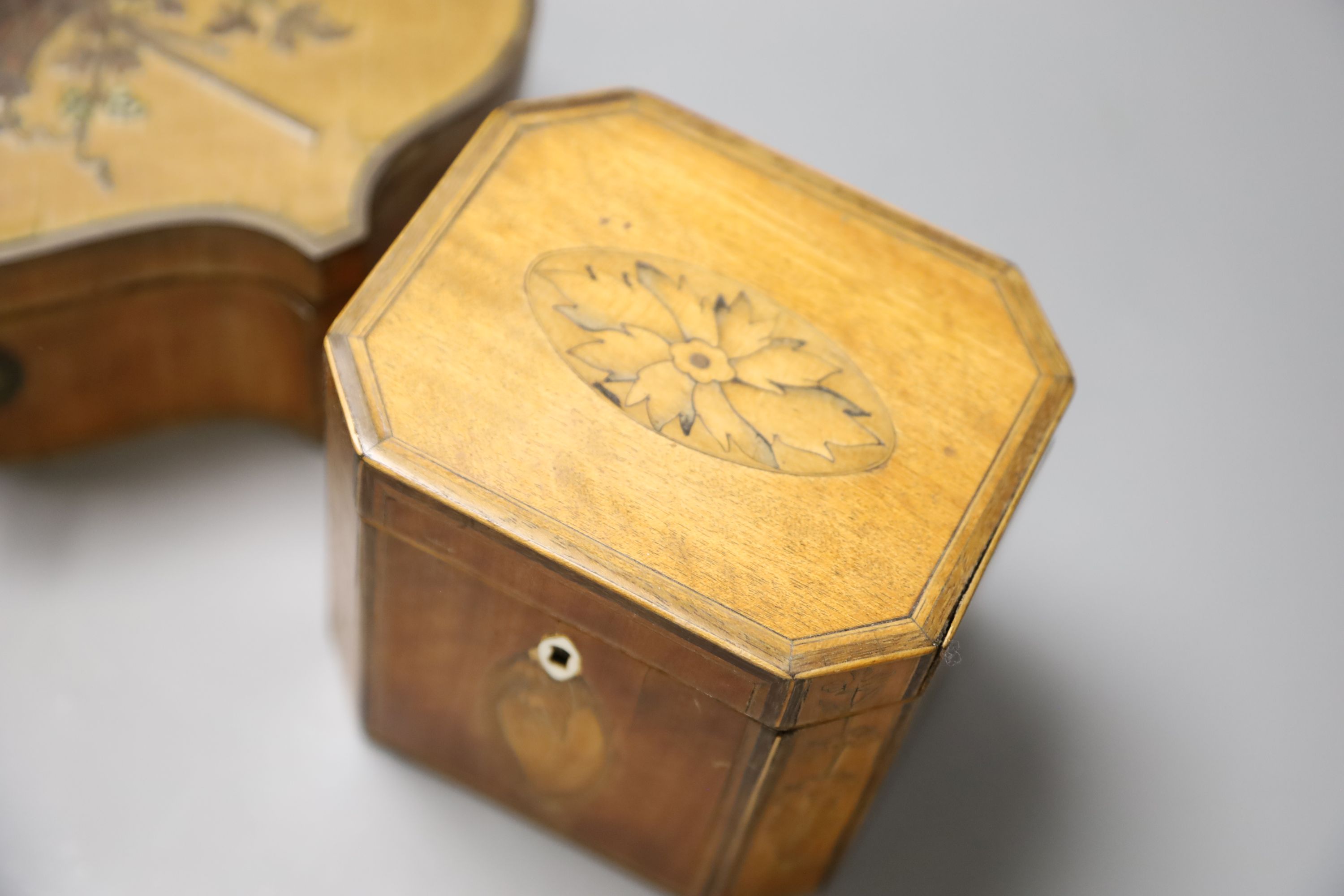 A marquetry serpentine work box, length 23.5cm, and an octagonal tea caddy